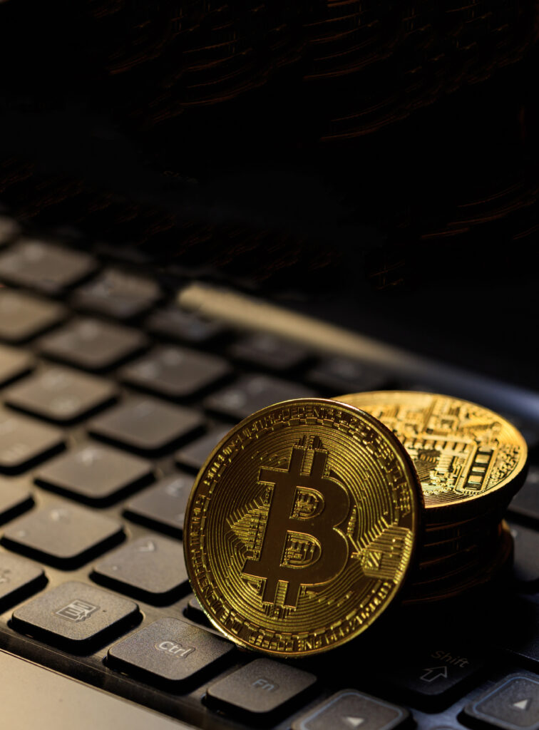 bitcoin-cryptocurrency-gold-coin-laptop-blockchain-technology-3d-illustration