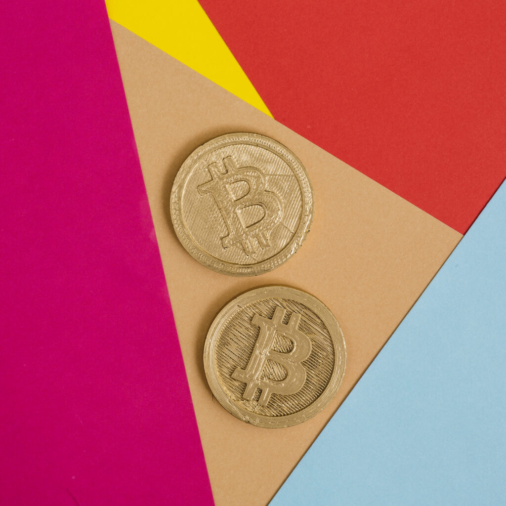 two-bitcoins-many-colorful-background